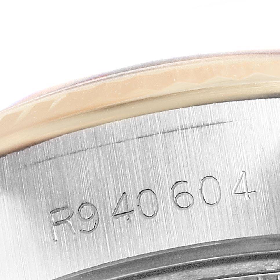 The image shows the engraved serial number on the side of the case of a Rolex Datejust 69173 Women's Stainless Steel Champagne Dial 69173 Women's Stainless Steel Champagne Dial watch.
