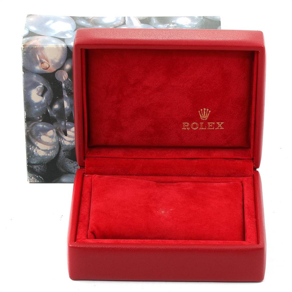 This image shows a red Rolex Datejust 69173 Women's Stainless Steel Champagne Dial 69173 Women's Stainless Steel Champagne Dial watch box with a velvet interior and the brand's logo in gold.