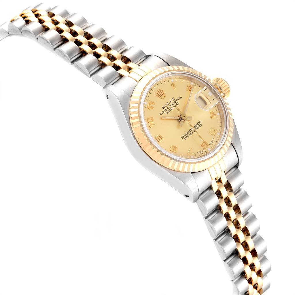 The Rolex Datejust 69173 Women's Stainless Steel Champagne Dial 69173 Women's Stainless Steel Champagne Dial watch is shown at a slight angle, displaying its gold dial, fluted bezel, and two-tone bracelet.