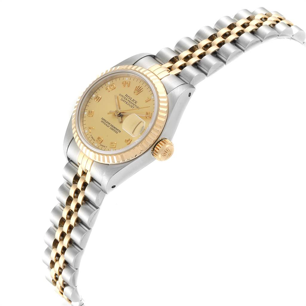 This image shows a side angle of the Rolex Datejust 69173 Women's Stainless Steel Champagne Dial 69173 Women's Stainless Steel Champagne Dial watch, displaying its two-tone bracelet, crown, and fluted bezel.