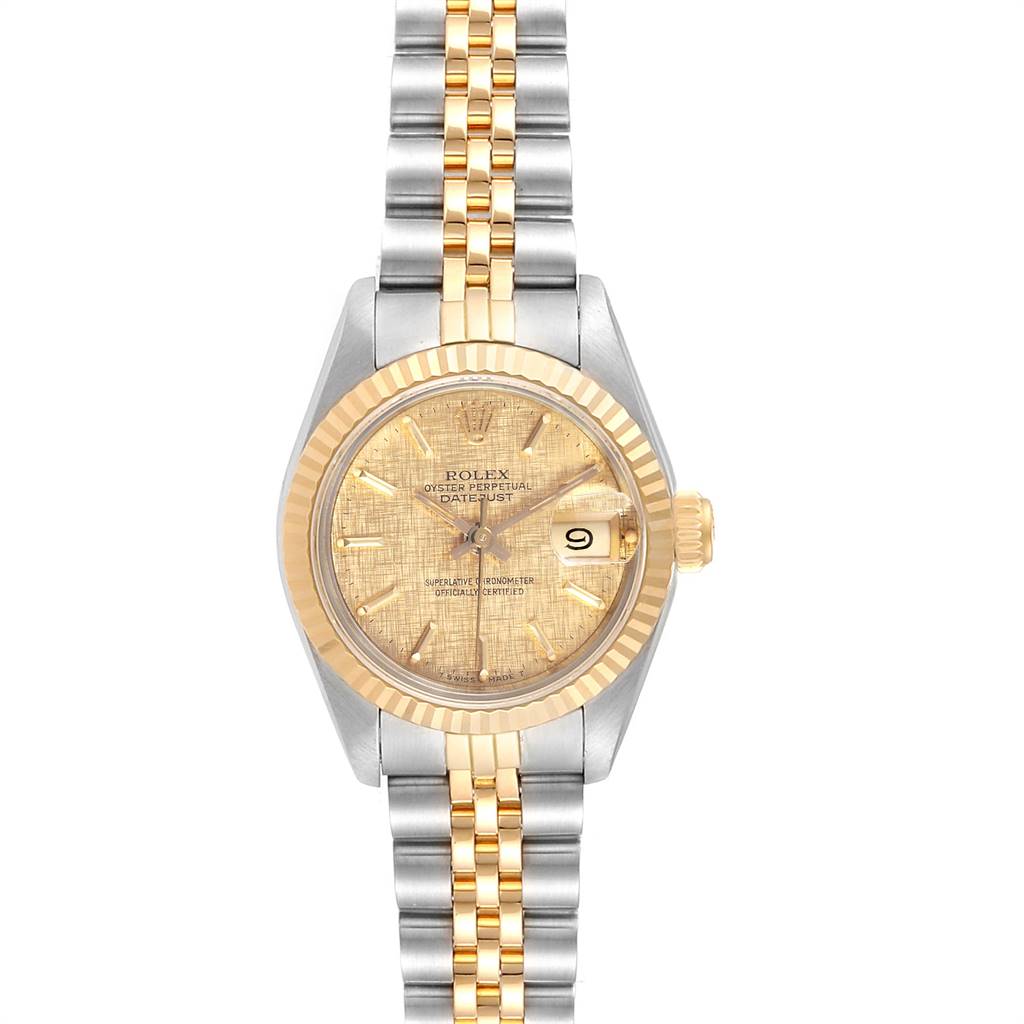 The Rolex Datejust 69173 Women's Stainless Steel Champagne Dial 69173 Women's Stainless Steel Champagne Dial watch is shown from a top-down angle, highlighting its dial, fluted bezel, and bi-color bracelet.