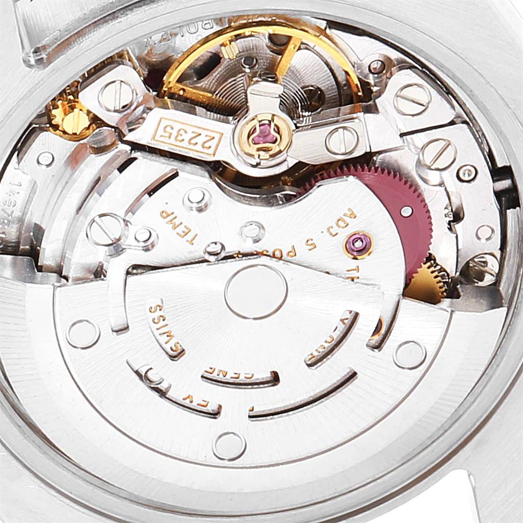 The image shows the internal components and intricate details of the Rolex Datejust 179173 Women's Steel and Gold (two tone) Champagne Dial 179173 Women's Steel and Gold (two tone) Champagne Dial watch movement.