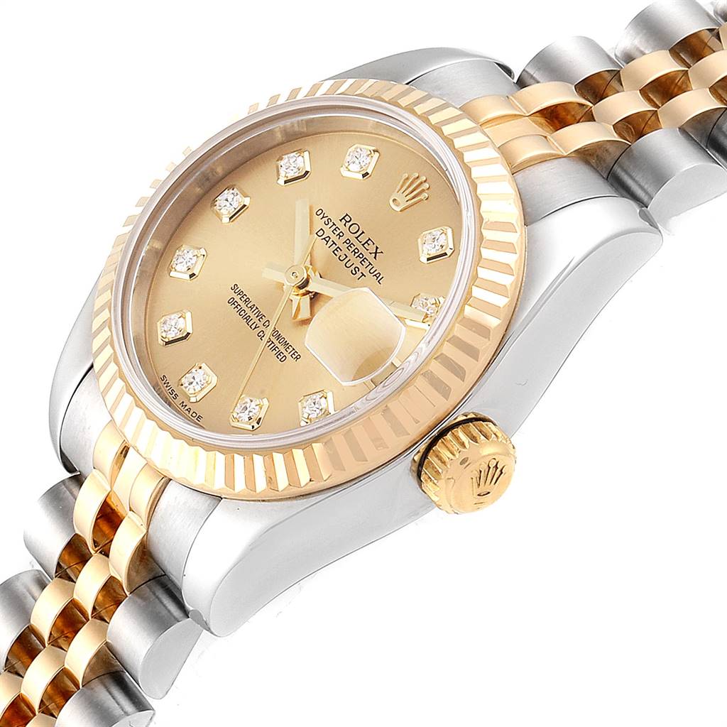 The Rolex Datejust 179173 Women's Steel and Gold (two tone) Champagne Dial 179173 Women's Steel and Gold (two tone) Champagne Dial watch is shown at an angled view, displaying the crown, bezel, dial, and part of the bracelet.