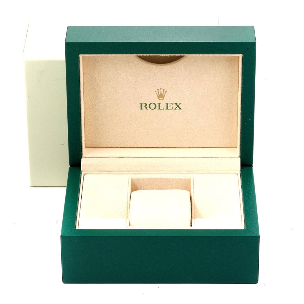 This image shows an open Rolex Datejust 179173 Women's Steel and Gold (two tone) Champagne Dial 179173 Women's Steel and Gold (two tone) Champagne Dial watch box with green exterior and beige interior.