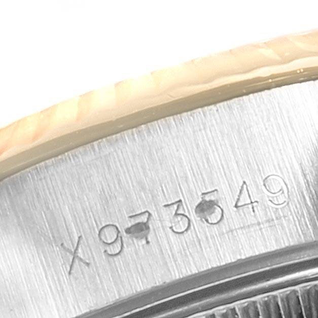 The image shows a close-up of the serial number engraved on the side of a Rolex Datejust 69173 Women's Stainless Steel Black Dial 69173 Women's Stainless Steel Black Dial watch case.