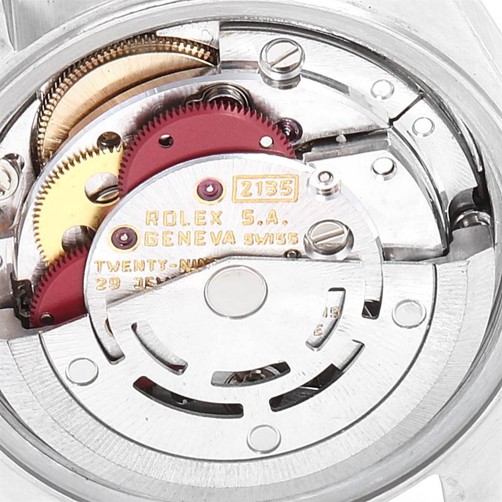 This image shows the internal movement components of a Rolex Datejust 69173 Women's Stainless Steel Black Dial 69173 Women's Stainless Steel Black Dial watch, focusing on gears and the rotor.
