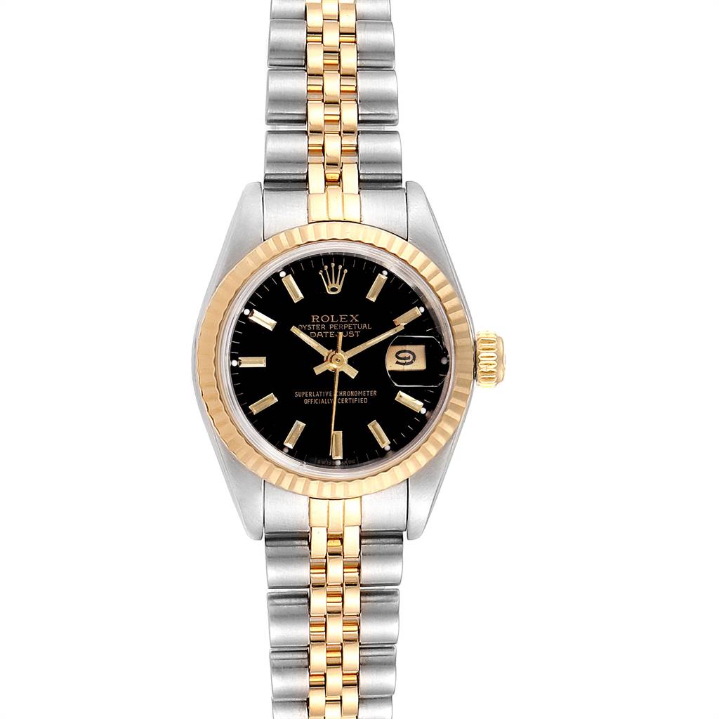This image shows a Rolex Datejust 69173 Women's Stainless Steel Black Dial 69173 Women's Stainless Steel Black Dial watch from a top-down angle, featuring a two-tone bracelet and a black dial.
