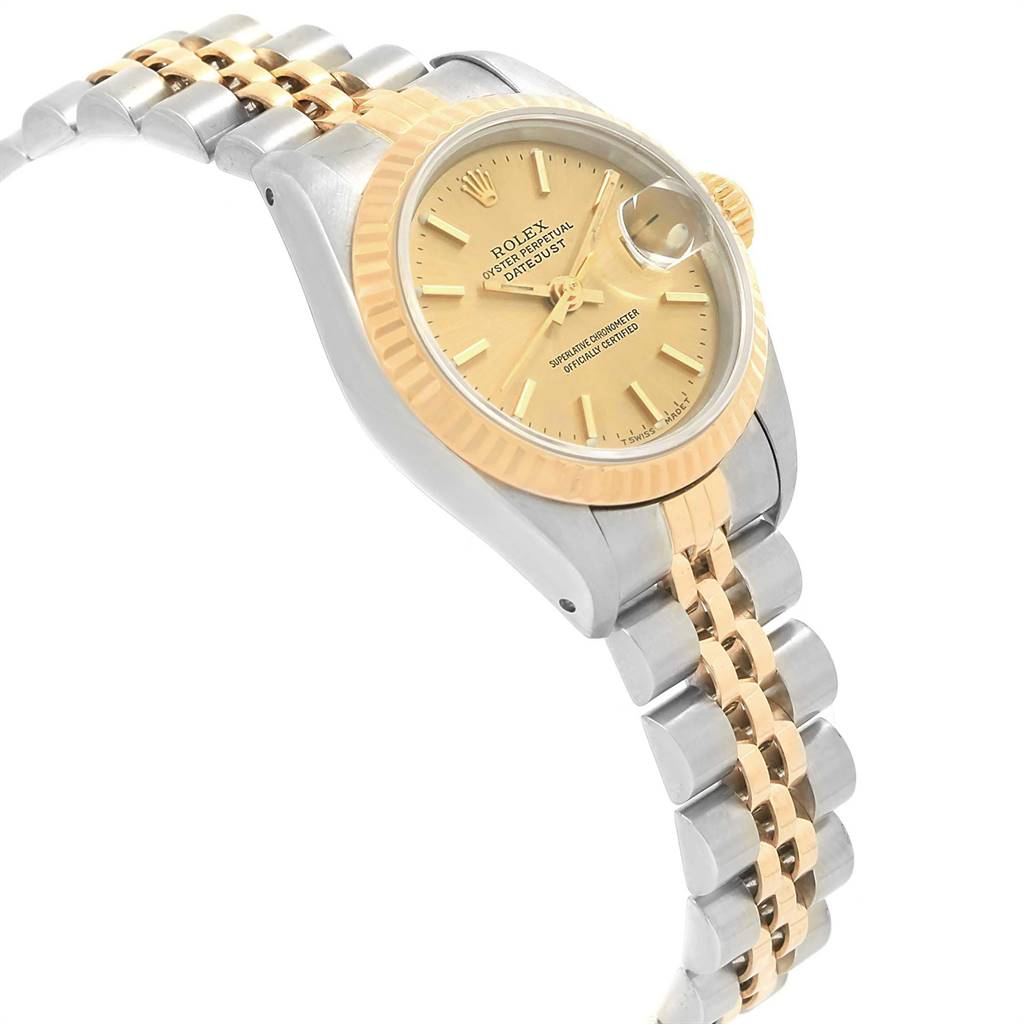 The photo depicts a Rolex Datejust 69173 Women's Steel and Gold (two tone) Champagne Dial 69173 Women's Steel and Gold (two tone) Champagne Dial watch at an angle, showing its gold dial, fluted bezel, and two-tone bracelet.