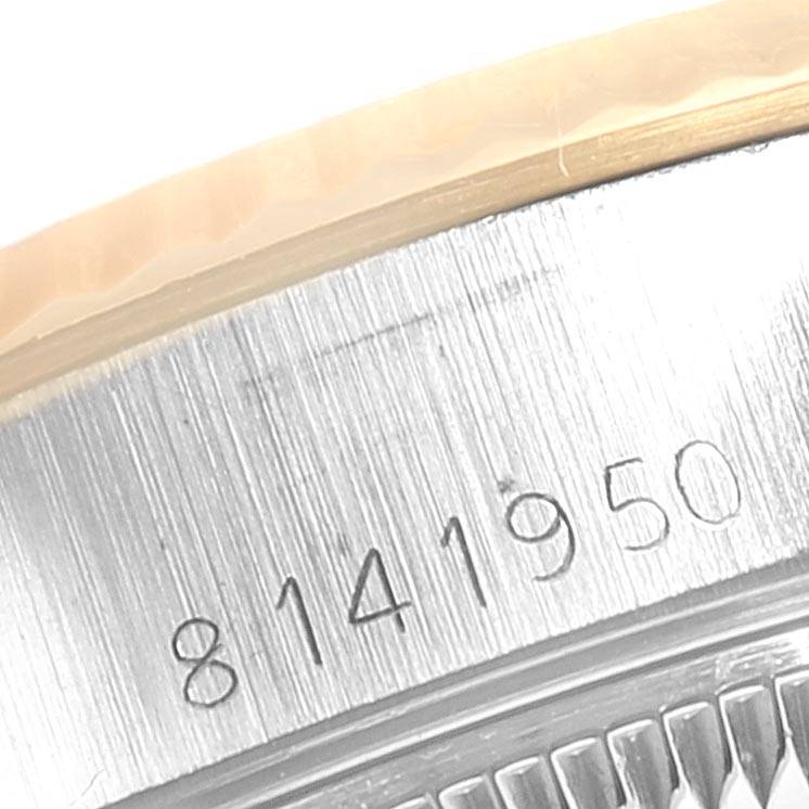 The close-up image shows the serial number engraved on the side of the Rolex Datejust 69173 Women's Stainless Steel Blue Dial 69173 Women's Stainless Steel Blue Dial watch case.