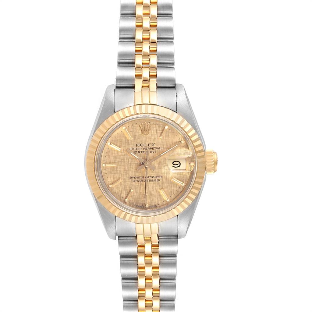 This Rolex Datejust 69173 Women's Stainless Steel Champagne Dial 69173 Women's Stainless Steel Champagne Dial watch is shown from a straight angle, featuring its champagne dial, two-tone bracelet, fluted bezel, and date window.