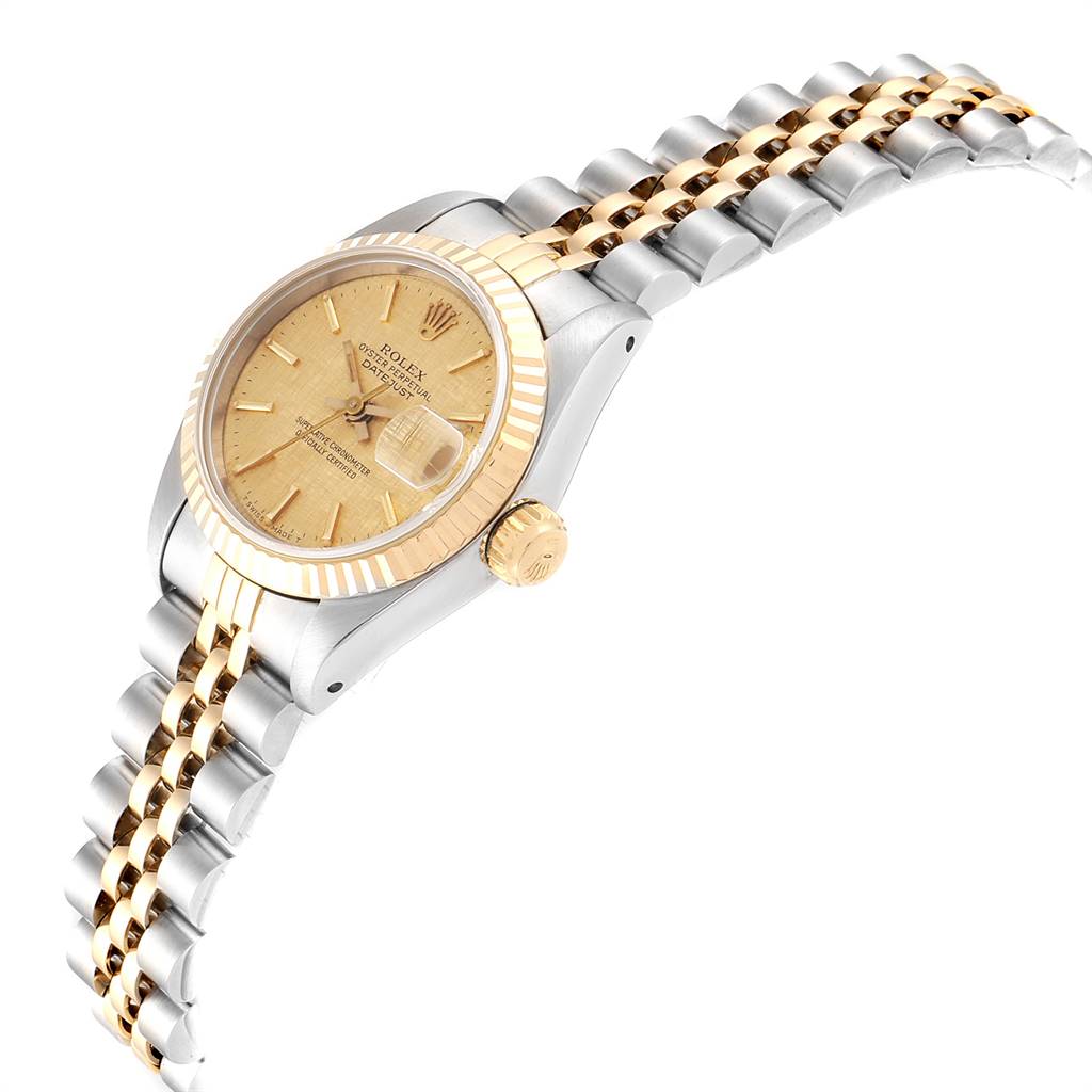 This image shows a side and top view of a Rolex Datejust 69173 Women's Stainless Steel Champagne Dial 69173 Women's Stainless Steel Champagne Dial with a gold bezel, gold dial, Jubilee bracelet, and fluted bezel.