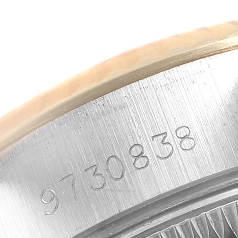 This is a close-up view of the serial number area on the case of a Rolex Datejust 69173 Women's Stainless Steel Blue Dial 69173 Women's Stainless Steel Blue Dial watch.