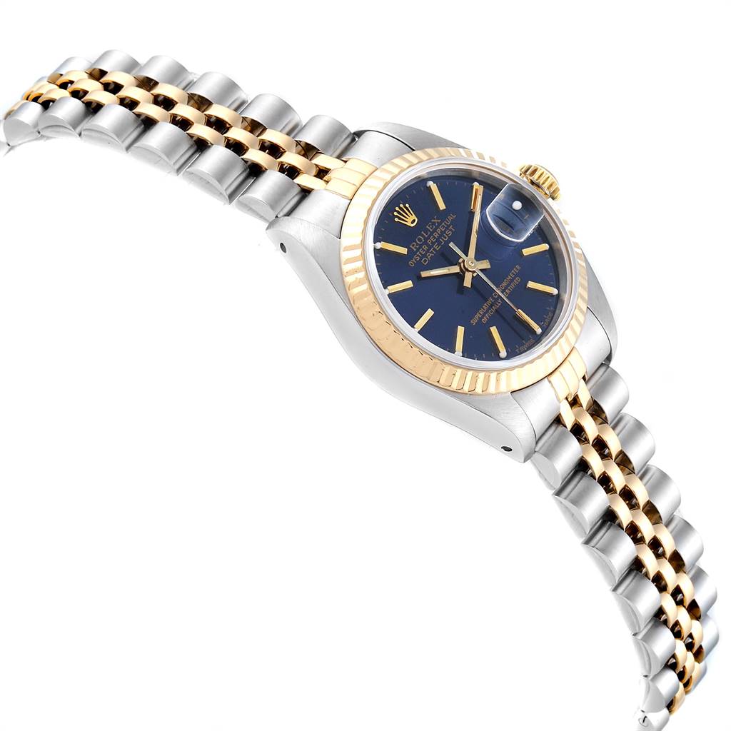 The image shows a side and top view of a Rolex Datejust 69173 Women's Stainless Steel Blue Dial 69173 Women's Stainless Steel Blue Dial watch, highlighting its blue dial, fluted bezel, and two-tone bracelet.