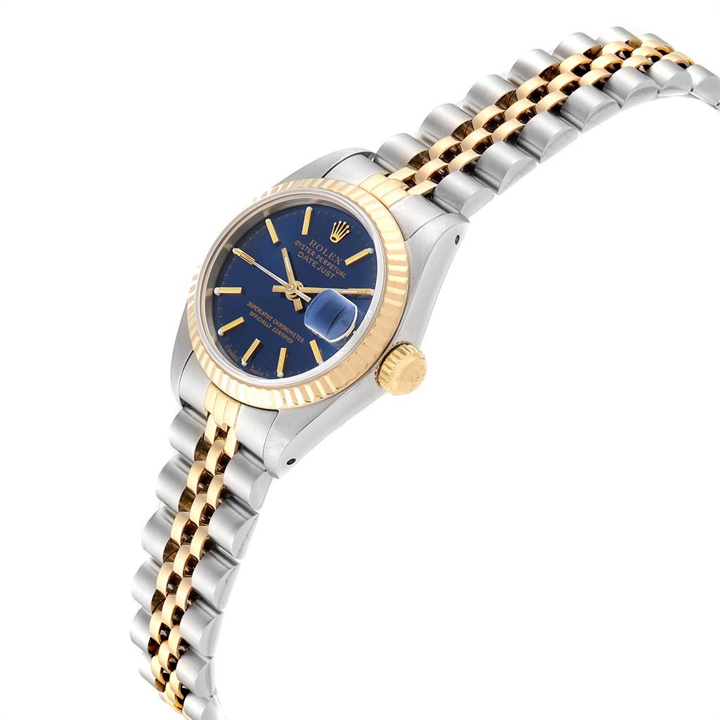 This image shows a side view of a Rolex Datejust 69173 Women's Stainless Steel Blue Dial 69173 Women's Stainless Steel Blue Dial watch, highlighting its blue dial, two-tone bracelet, crown, and fluted bezel.