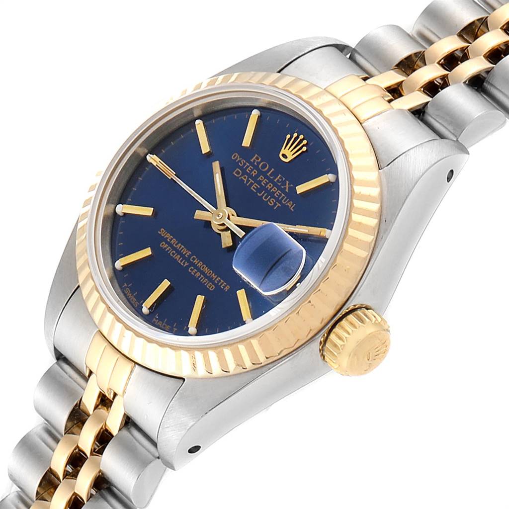 The image shows a side angle view of a Rolex Datejust 69173 Women's Stainless Steel Blue Dial 69173 Women's Stainless Steel Blue Dial watch, highlighting its blue dial, gold bezel, and bi-metal bracelet.