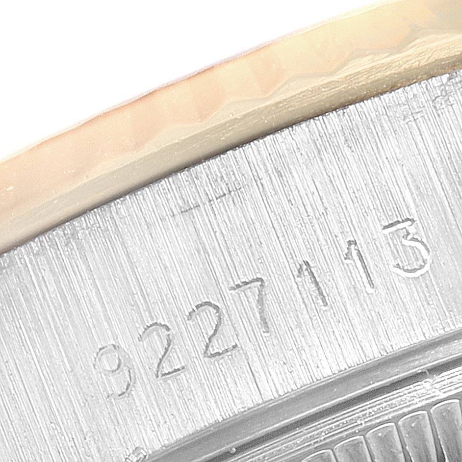 This image shows a macro view of the serial number engraving on the case back of a Rolex Datejust 69173 Women's Stainless Steel Champagne Dial 69173 Women's Stainless Steel Champagne Dial watch.