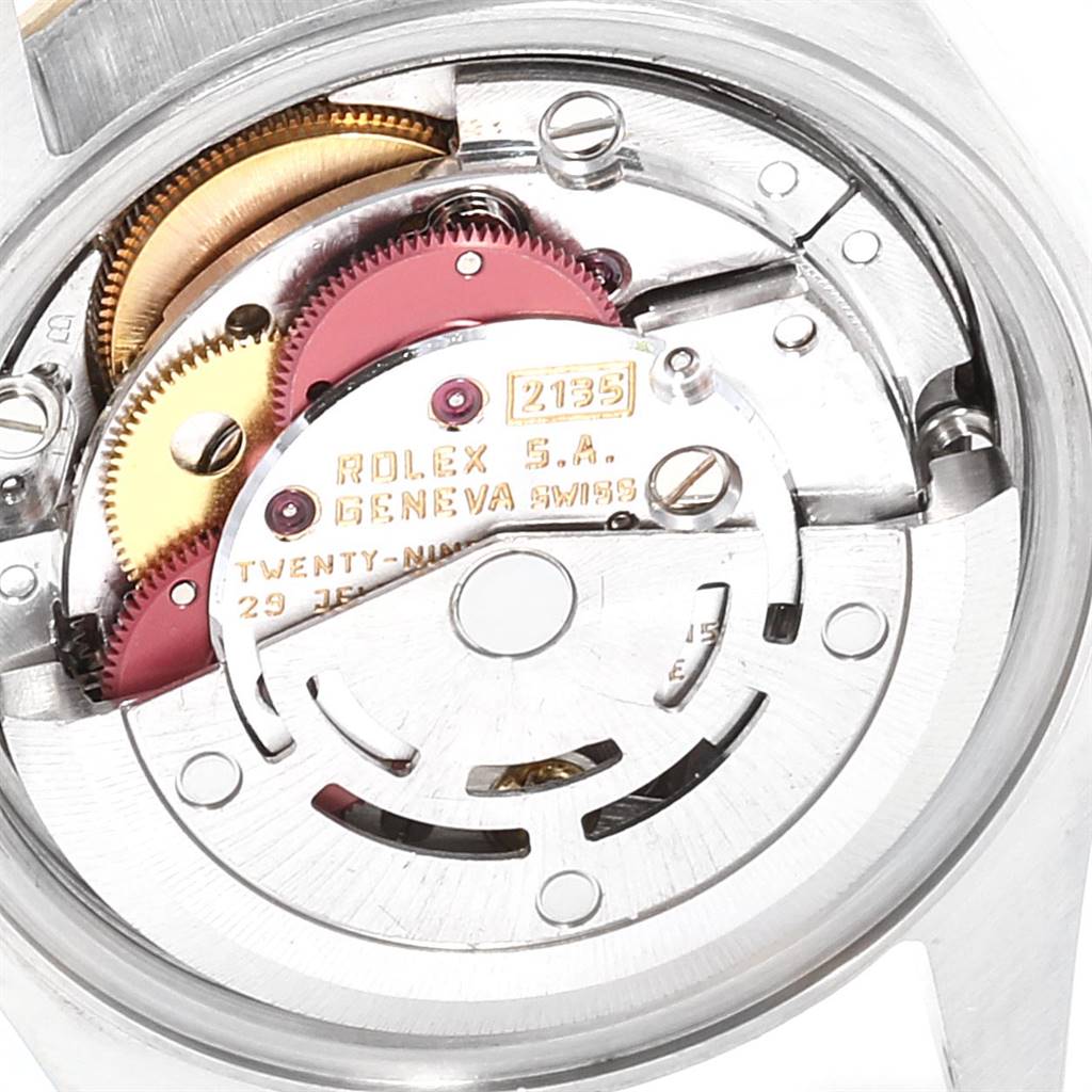 The image shows an internal view of a Rolex Datejust 69173 Women's Stainless Steel Champagne Dial 69173 Women's Stainless Steel Champagne Dial watch, highlighting its movement and gears.