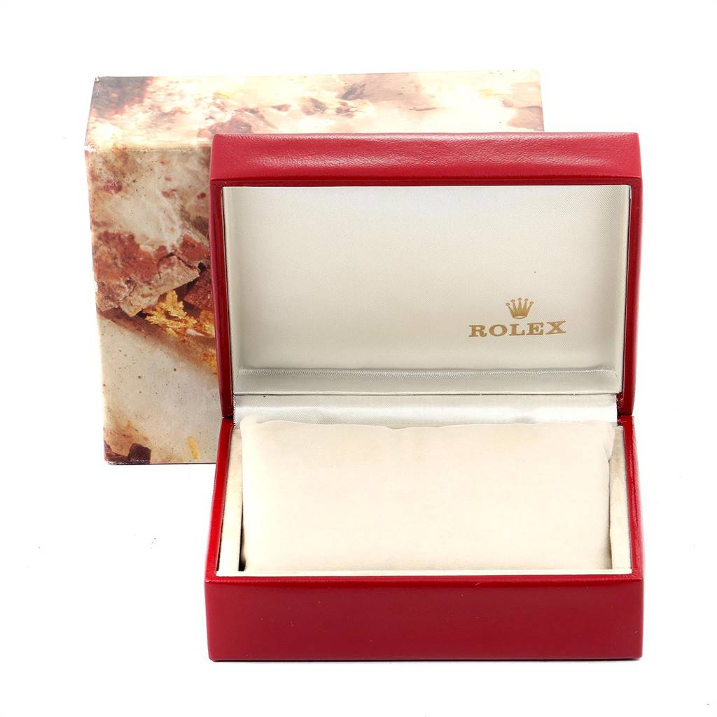 This image shows an open Rolex watch box for the Datejust model, featuring a red exterior and branded interior.