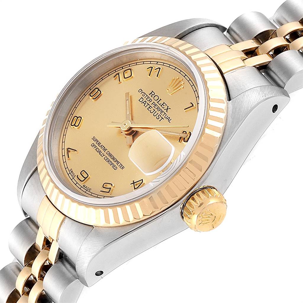 The Rolex Datejust 69173 Women's Stainless Steel Champagne Dial 69173 Women's Stainless Steel Champagne Dial watch is shown at an angle showcasing its dial, fluted bezel, crown, and part of the two-tone bracelet.