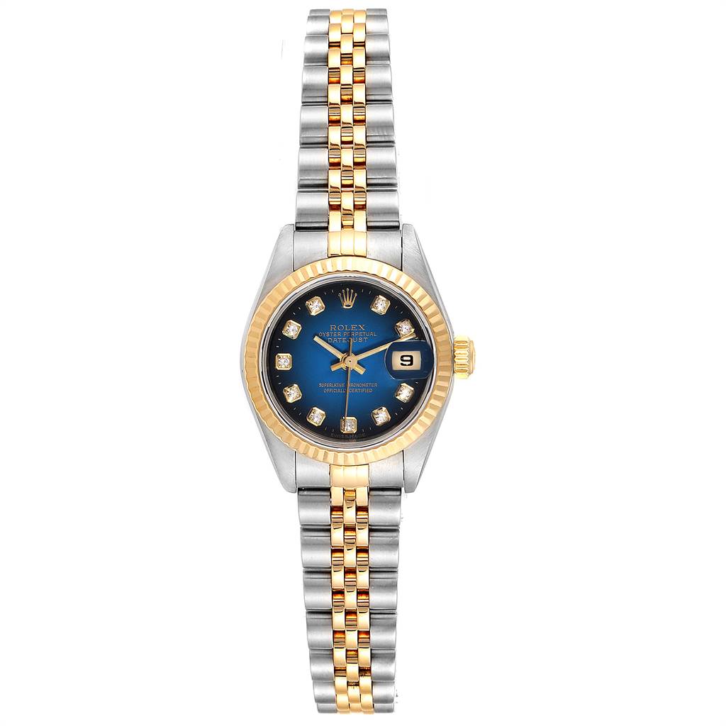 This image shows a Rolex Datejust 79173 Women
s Steel and Gold (two tone) Blue Dial 79173 Women
s Steel and Gold (two tone) Blue Dial watch with a blue dial, gold fluted bezel, and a two-tone Jubilee bracelet from a top-down angle.