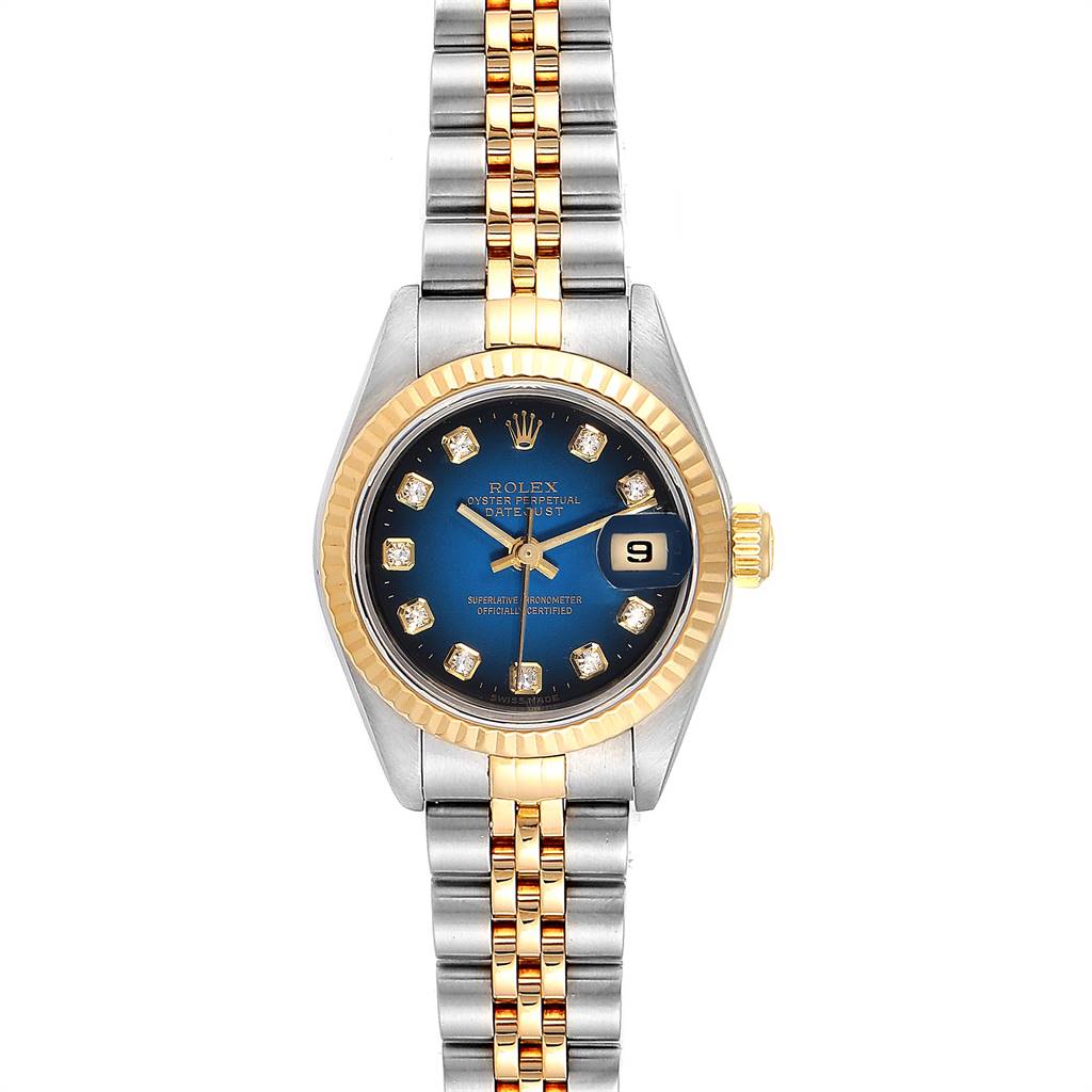 The image shows a Rolex Datejust 79173 Women
s Steel and Gold (two tone) Blue Dial 79173 Women
s Steel and Gold (two tone) Blue Dial watch, front view, featuring a two-tone bracelet, fluted bezel, and blue dial with diamond hour markers.
