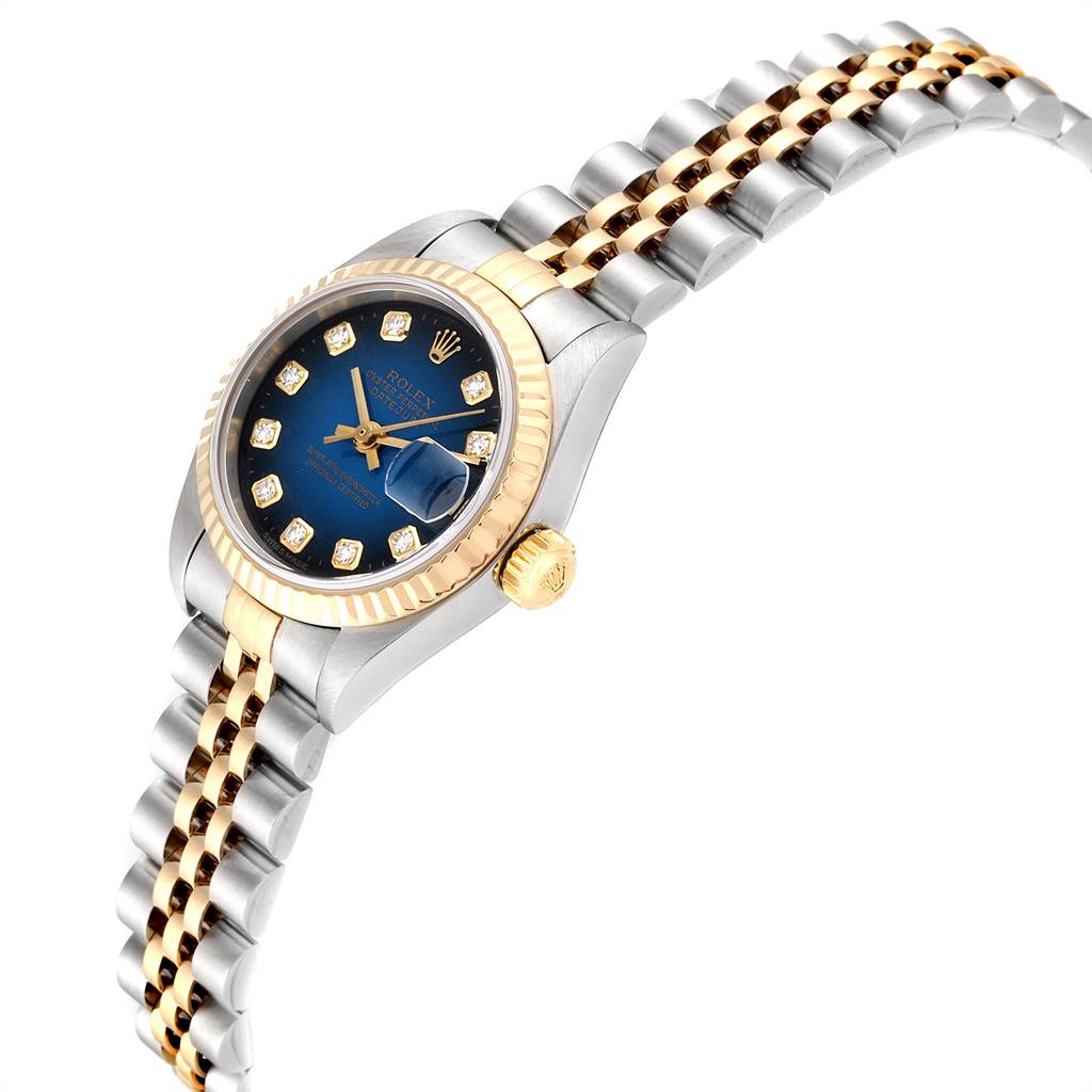 The Rolex Datejust 79173 Women
s Steel and Gold (two tone) Blue Dial 79173 Women
s Steel and Gold (two tone) Blue Dial watch is shown at a side angle, highlighting its blue dial, diamond indices, and two-tone bracelet.