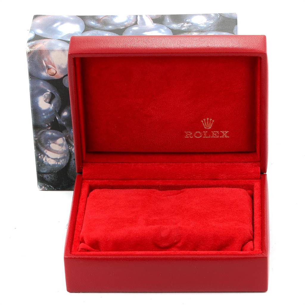 This image shows an open red Rolex Datejust 79173 Women
s Steel and Gold (two tone) Blue Dial 79173 Women
s Steel and Gold (two tone) Blue Dial watch box with a velvet interior and the brand logo inside the lid.