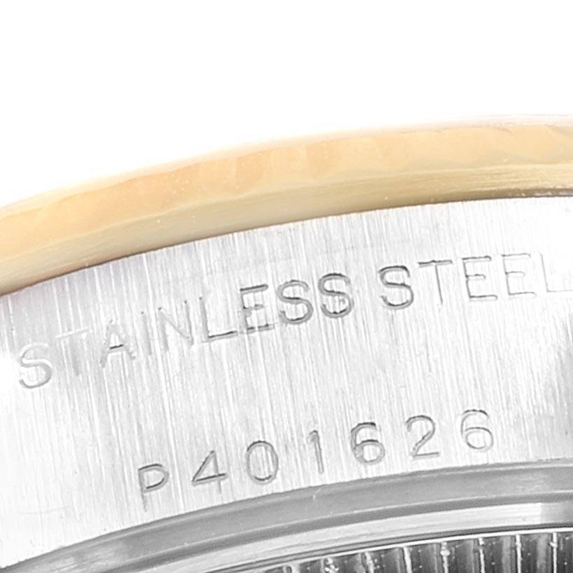 This image shows a close-up of the stainless steel case back and part of the bezel of a Rolex Datejust 79173 Women
s Steel and Gold (two tone) Blue Dial 79173 Women
s Steel and Gold (two tone) Blue Dial watch.