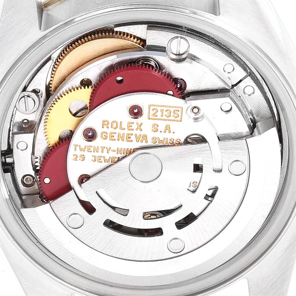 This image shows the movement mechanism of a Rolex Datejust 69173 Women's Stainless Steel Champagne Dial 69173 Women's Stainless Steel Champagne Dial watch from the back angle, revealing gears and internal components.