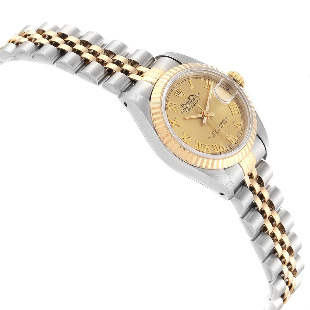 The image shows a side angle of the Rolex Datejust 69173 Women's Stainless Steel Champagne Dial 69173 Women's Stainless Steel Champagne Dial watch, highlighting its gold and silver bracelet and gold fluted bezel.