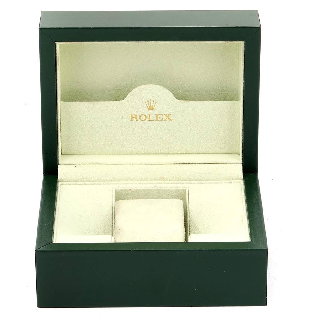 This is an open green Rolex box likely for a Datejust model, showing the interior compartments and cushioned area for the watch.
