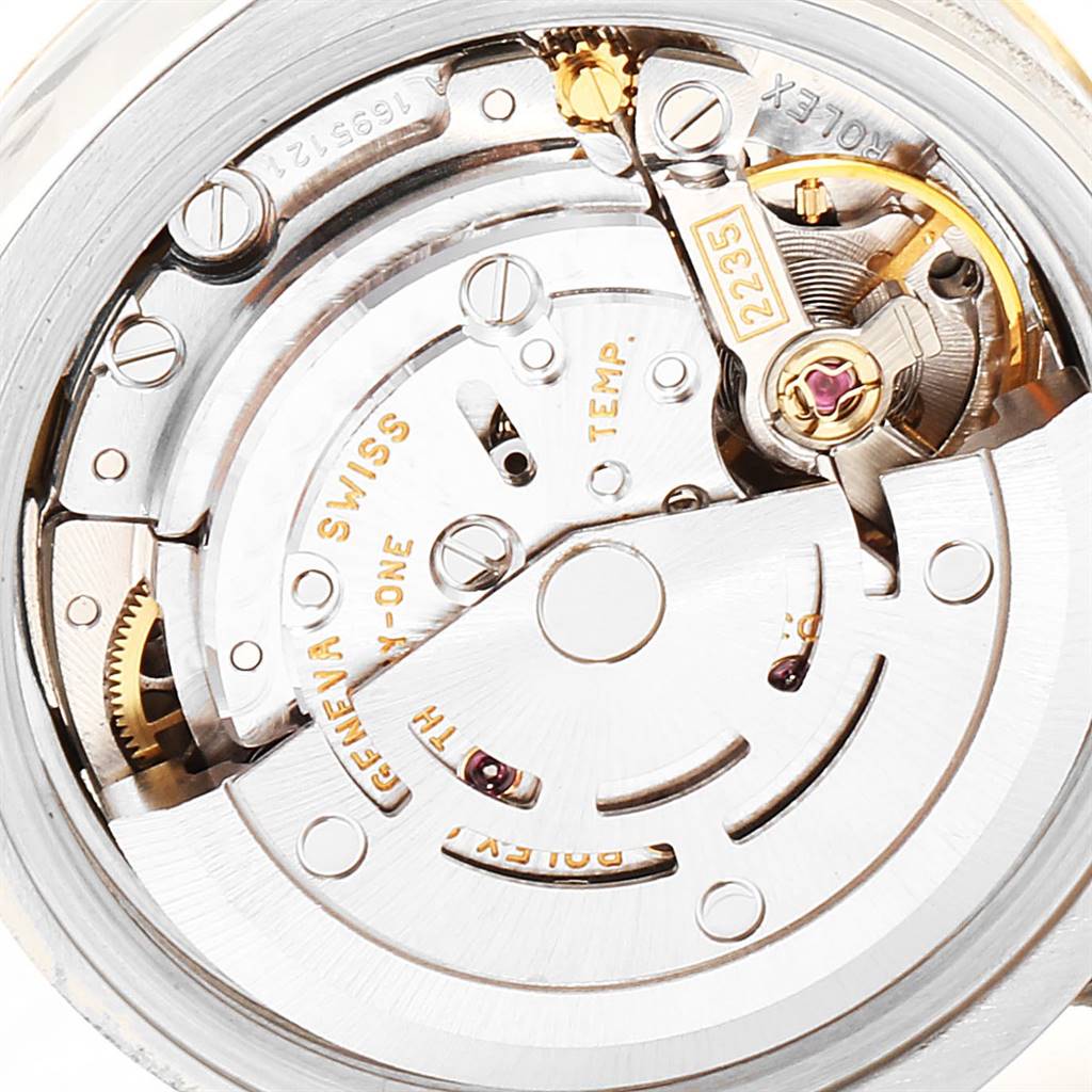 This image shows a close-up view of the Rolex Datejust 179173 Women's Steel and Gold (two tone) White Dial 179173 Women's Steel and Gold (two tone) White Dial movement mechanism, highlighting gears and inscriptions.