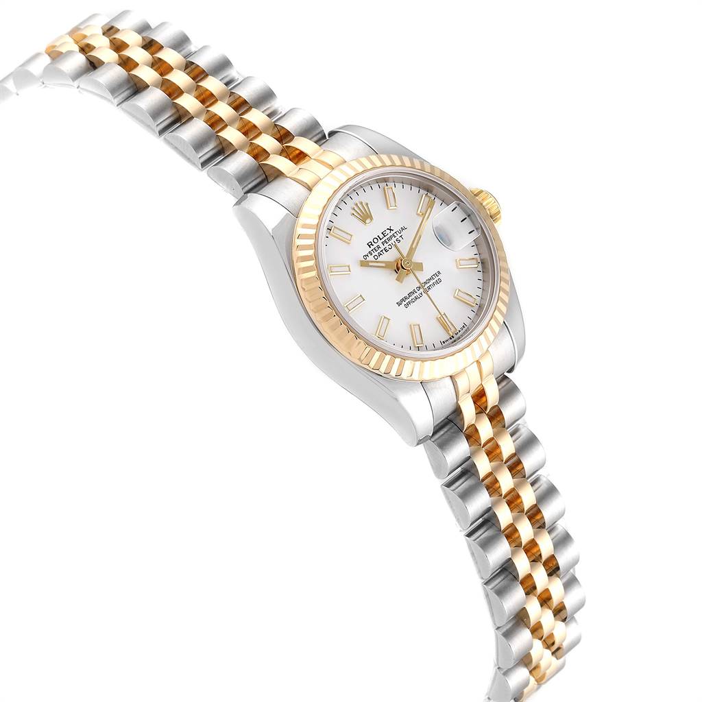 This image shows a Rolex Datejust 179173 Women's Steel and Gold (two tone) White Dial 179173 Women's Steel and Gold (two tone) White Dial watch at a slight right angle, highlighting its two-tone bracelet, fluted bezel, and white dial.