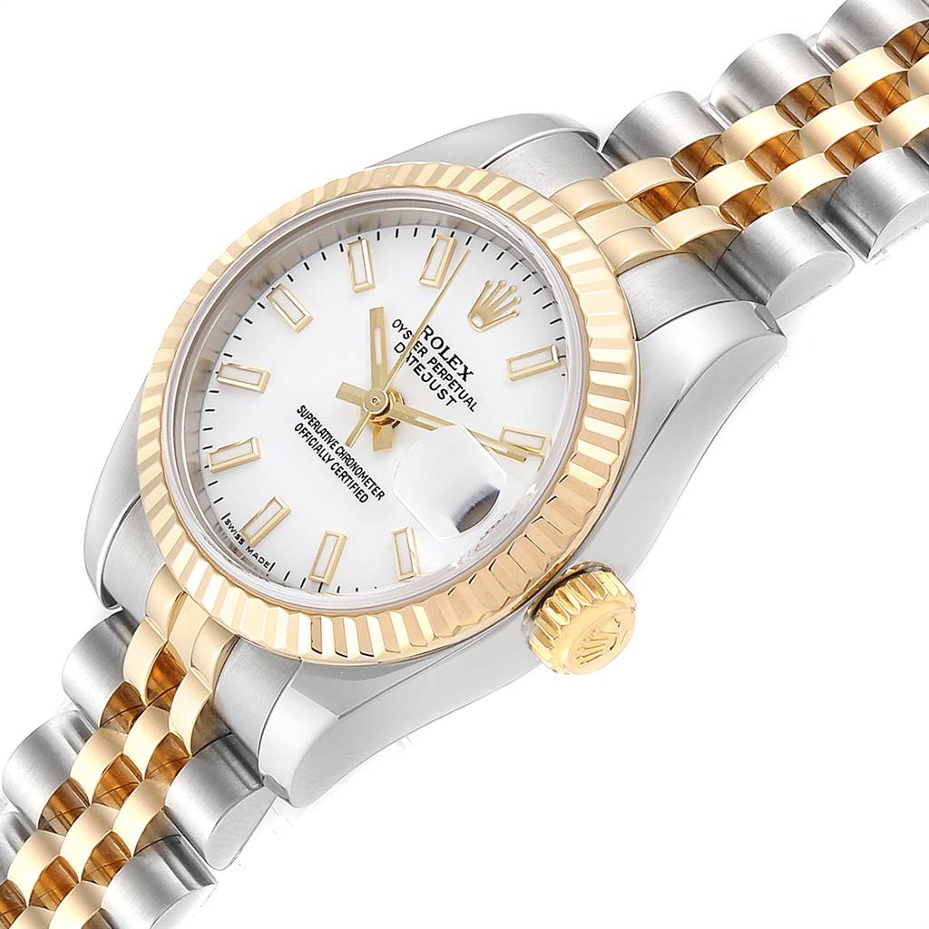 This image shows a Rolex Datejust 179173 Women's Steel and Gold (two tone) White Dial 179173 Women's Steel and Gold (two tone) White Dial watch at a tilted angle, highlighting the bezel, dial, crown, and part of the bracelet.