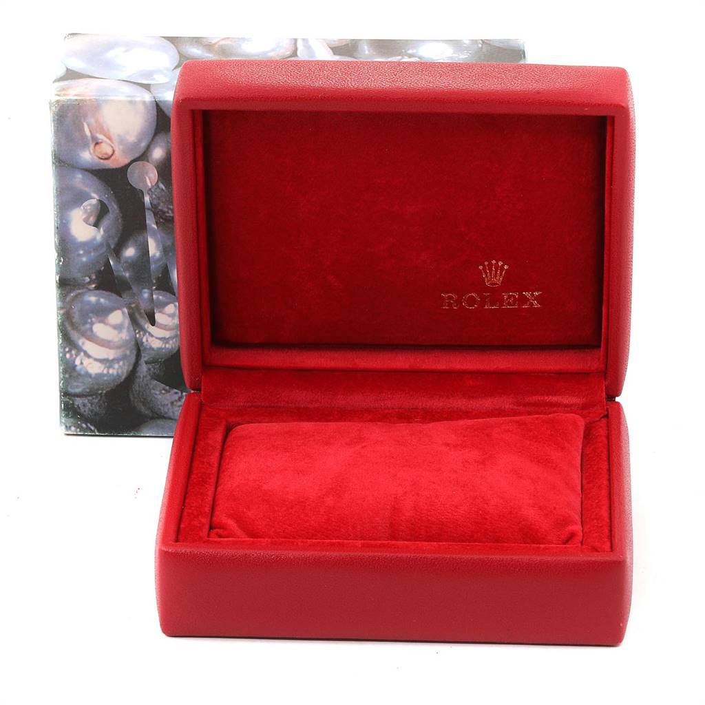 The image shows an empty red Rolex watch box, open with a cushion inside, for the Datejust model.