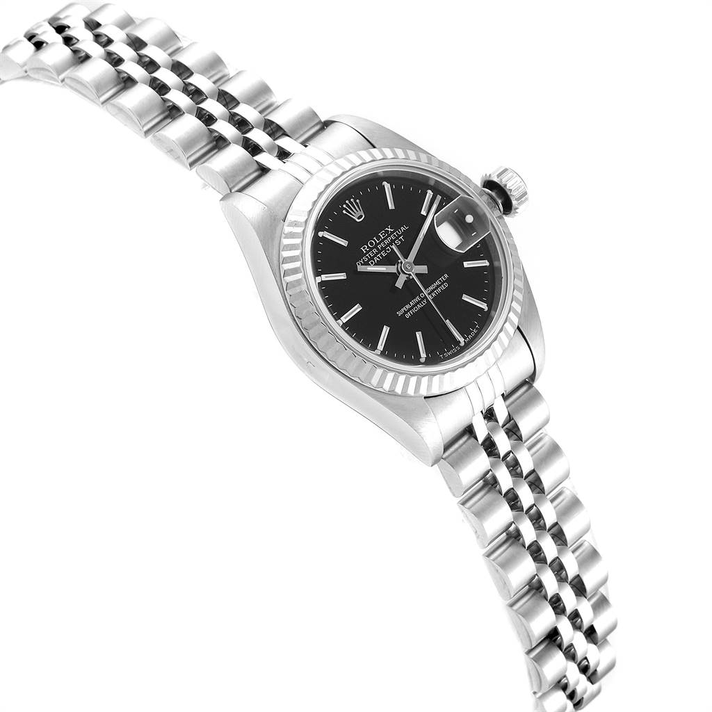 This image shows a Rolex Datejust 69174 Women's Stainless Steel Black Dial 69174 Women's Stainless Steel Black Dial watch at an angled side view, highlighting its bezel, crown, black dial, and jubilee bracelet.