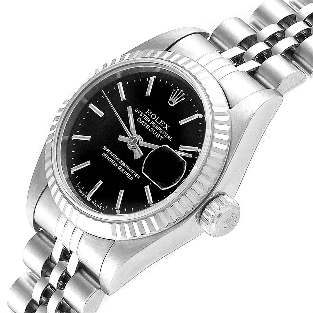 The image shows a Rolex Datejust 69174 Women's Stainless Steel Black Dial 69174 Women's Stainless Steel Black Dial watch from an angled top view, highlighting its black dial, fluted bezel, and Jubilee bracelet.