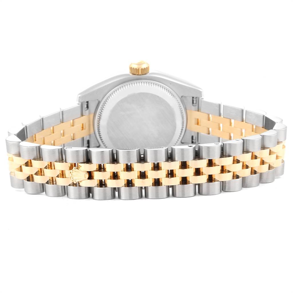 The image shows the back view of a Rolex Datejust 179173 Women
s Steel and Gold (two tone) Black Dial 179173 Women
s Steel and Gold (two tone) Black Dial watch, focusing on its two-tone metal bracelet and case back.