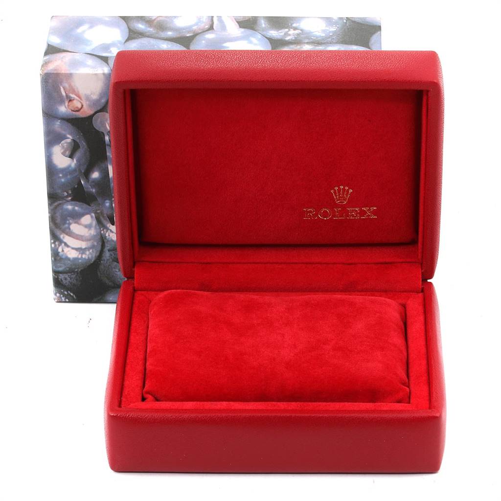 This image shows an open red Rolex box, for a Datejust model, with a cushion inside.