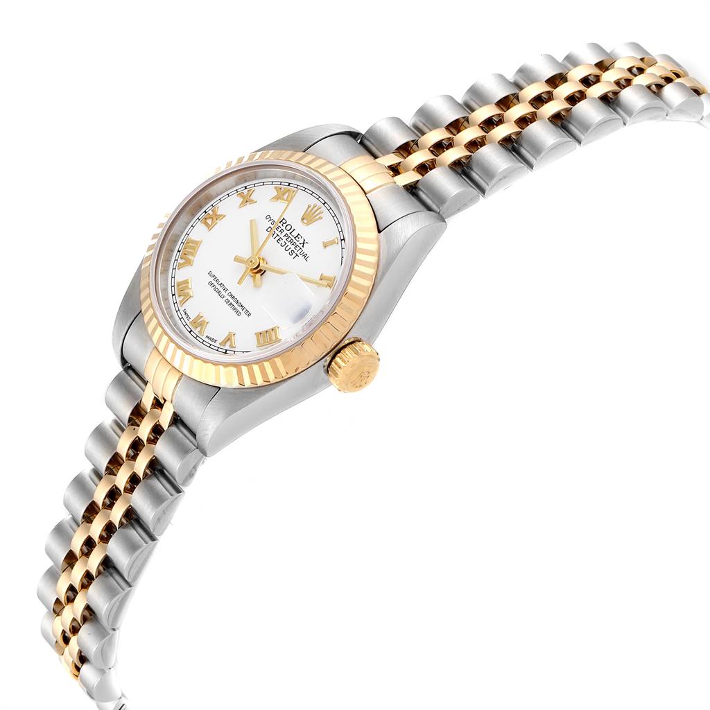 The Rolex Datejust 69173 Women's Stainless Steel White Dial 69173 Women's Stainless Steel White Dial watch is shown at a slight side angle, highlighting its two-tone bracelet, fluted bezel, and face with Roman numerals.