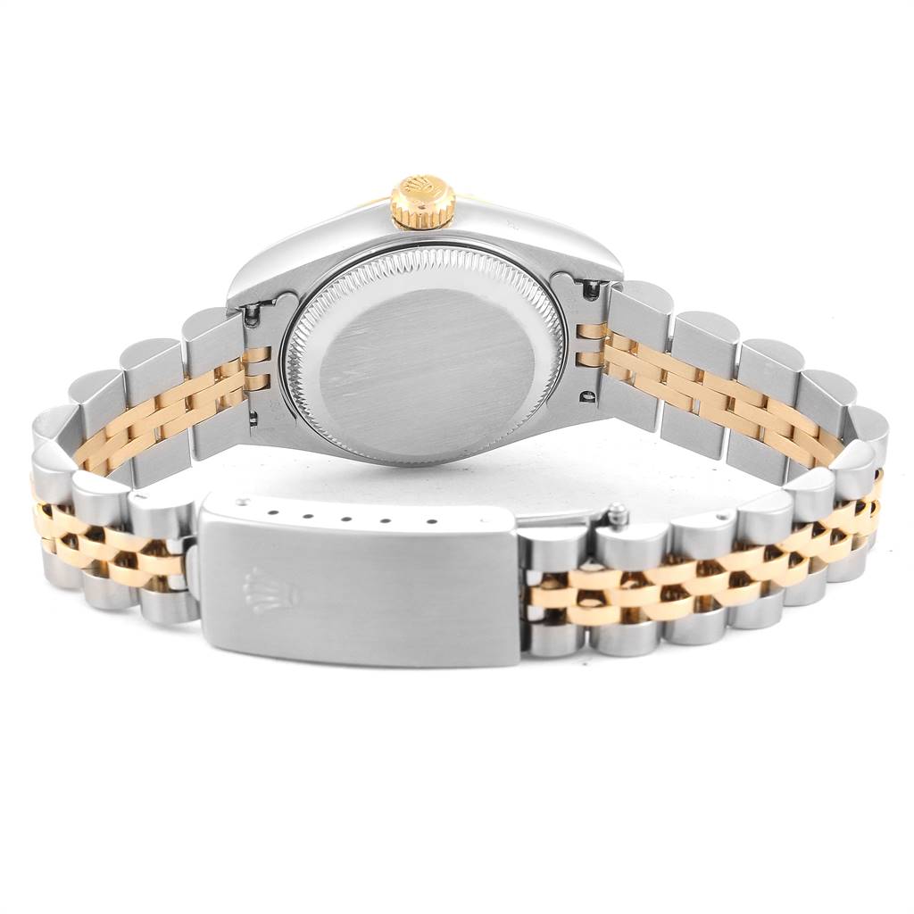 An image of the back and bracelet of a Rolex Datejust 79173 Women
s Steel and Gold (two tone) Champagne Dial 79173 Women
s Steel and Gold (two tone) Champagne Dial watch, showcasing its two-tone metal links and clasp.