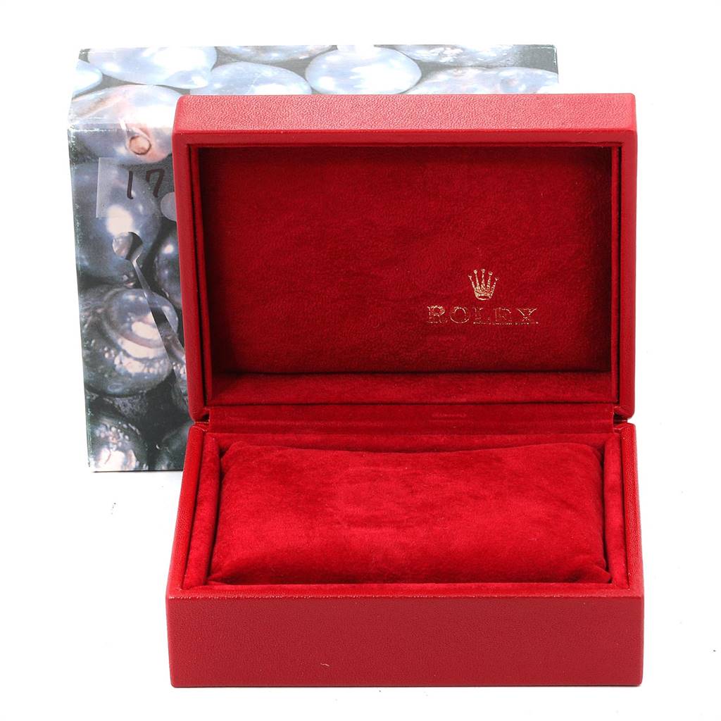 This image shows a red open box for a Rolex Datejust 79173 Women
s Steel and Gold (two tone) Champagne Dial 79173 Women
s Steel and Gold (two tone) Champagne Dial watch, displaying the interior lining and cushion.