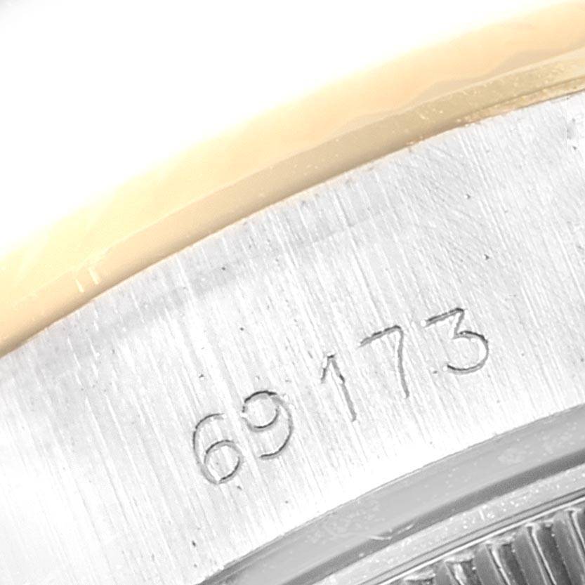 This close-up angle shows the engraved serial number on the metal case back of a Rolex Datejust 69173 Women
s Stainless Steel Black Dial 69173 Women
s Stainless Steel Black Dial watch.