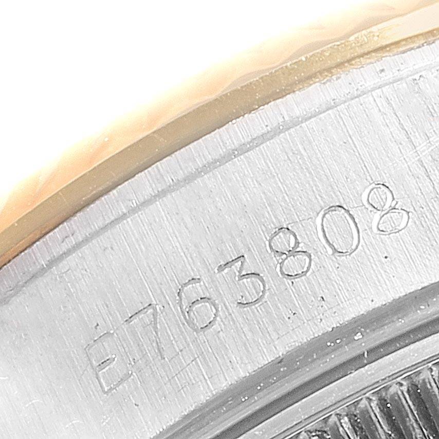 This close-up image shows the serial number engraved on the side of a Rolex Datejust 69173 Women
s Stainless Steel Black Dial 69173 Women
s Stainless Steel Black Dial watch case.