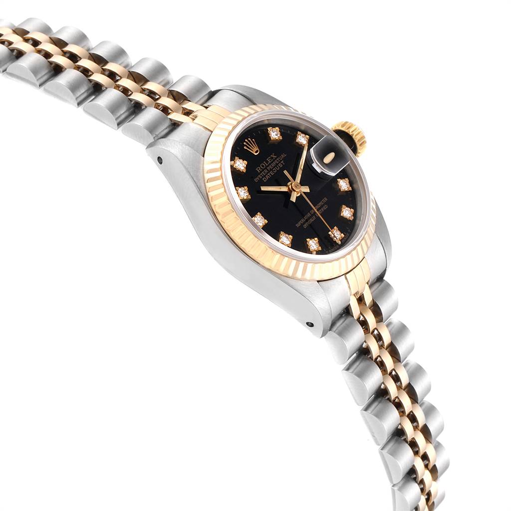 The Rolex Datejust 69173 Women
s Stainless Steel Black Dial 69173 Women
s Stainless Steel Black Dial watch is shown at a tilted angle highlighting its two-tone bracelet, fluted bezel, and diamond hour markers on its black dial.