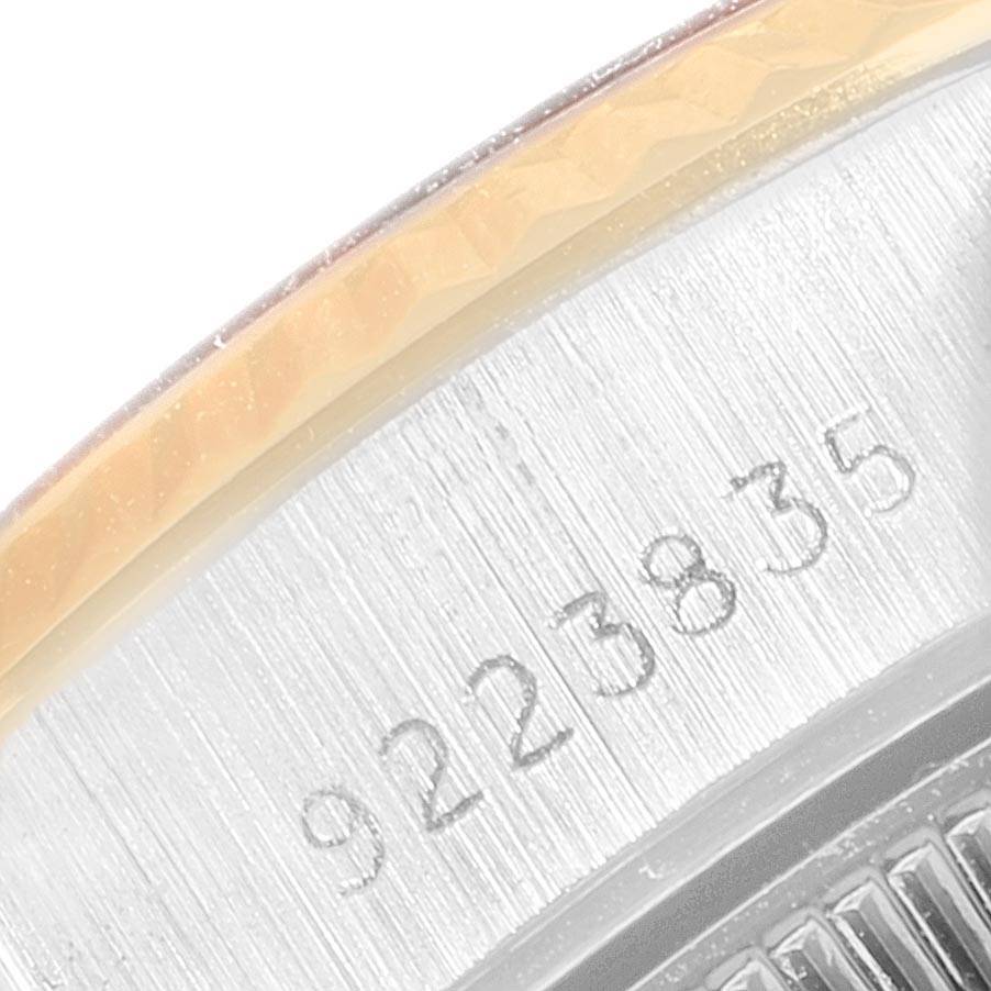This image shows a close-up of the engraved serial number on the case of a Rolex Datejust 69173 Women's Stainless Steel Silver Dial 69173 Women's Stainless Steel Silver Dial watch.