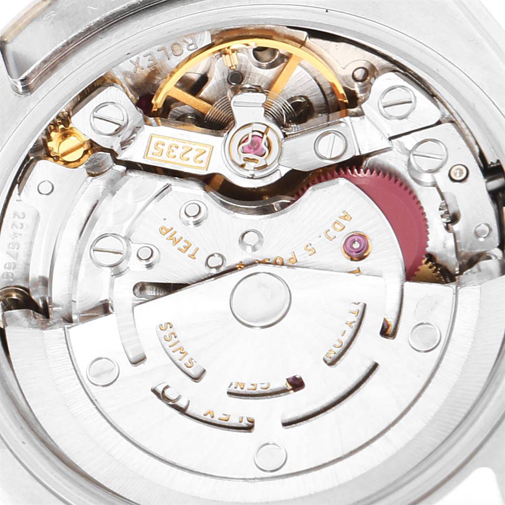 This image shows a close-up of the movement mechanism inside the Rolex Datejust 179174 Women
s Stainless Steel Black Dial 179174 Women
s Stainless Steel Black Dial watch.