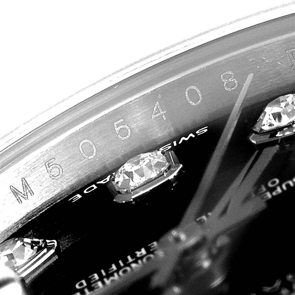 This close-up image of the Rolex Datejust 179174 Women
s Stainless Steel Black Dial 179174 Women
s Stainless Steel Black Dial shows part of the dial, diamond hour markers, hands, and serial number.