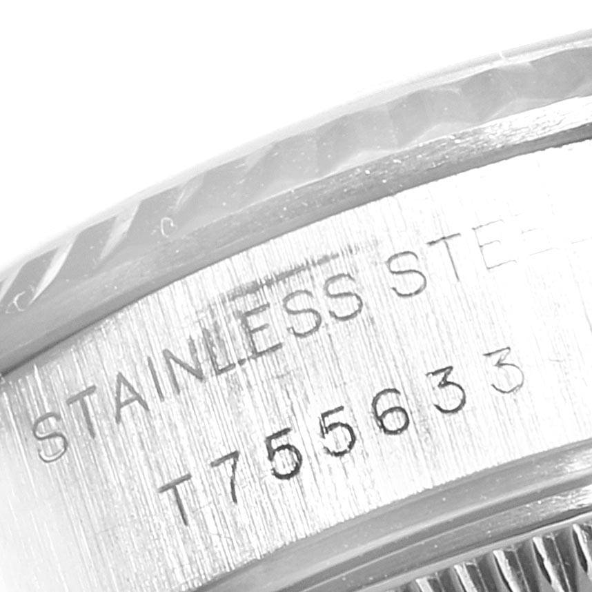 This image shows a close-up of the stainless steel casing and engraved serial number of the Rolex Datejust 69174 Women's Stainless Steel White Dial 69174 Women's Stainless Steel White Dial watch.