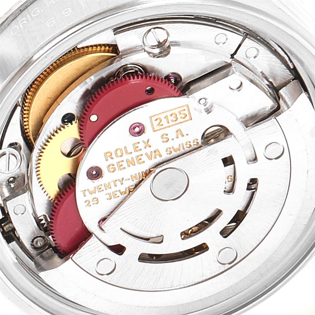 The image shows a close-up of the movement mechanism in a Rolex Datejust 69174 Women's Stainless Steel White Dial 69174 Women's Stainless Steel White Dial watch.